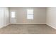 Spacious bedroom features neutral carpet, white trim and lots of natural light at 6202 Humphries Hill Rd, Austell, GA 30106