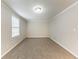 Cozy bedroom with plush carpeting, fresh paint, and natural light at 6202 Humphries Hill Rd, Austell, GA 30106