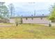 Exterior view of the home with a grass yard and vinyl siding at 6202 Humphries Hill Rd, Austell, GA 30106