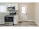 Well-appointed kitchen with stainless steel appliances and granite countertops at 6202 Humphries Hill Rd, Austell, GA 30106