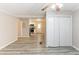 Inviting living room with view to kitchen, featuring gray floors and neutral paint at 6202 Humphries Hill Rd, Austell, GA 30106