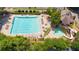 Community pool and clubhouse with a slide and ample seating area for relaxation and recreation at 6360 Brookline Ct, Cumming, GA 30040