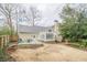 Landscaped backyard featuring a patio and lush greenery at 6360 Brookline Ct, Cumming, GA 30040