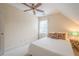 Charming bedroom with a ceiling fan, natural light, and minimalist design offers a serene escape at 6360 Brookline Ct, Cumming, GA 30040