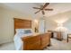 Bedroom with wood-slat bed frame, light colored carpet and desk area at 6360 Brookline Ct, Cumming, GA 30040