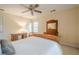 This inviting bedroom features a ceiling fan, natural light, and cozy décor, perfect for relaxation at 6360 Brookline Ct, Cumming, GA 30040