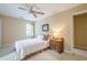 Serene bedroom with a ceiling fan, bedside table, and soft lighting creates a calming atmosphere at 6360 Brookline Ct, Cumming, GA 30040