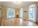 Sunlit dining room boasting hardwood floors and large windows at 6360 Brookline Ct, Cumming, GA 30040