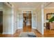 Elegant foyer with hardwood floors and double doors leading to the interior at 6360 Brookline Ct, Cumming, GA 30040