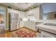 Bright kitchen with white cabinets, stainless steel appliances, and marble countertops at 6360 Brookline Ct, Cumming, GA 30040