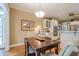 Kitchen breakfast nook showcasing a dark wood table and large picture window at 6360 Brookline Ct, Cumming, GA 30040