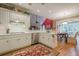 Spacious kitchen featuring stainless appliances, ample counter space, and hardwood floors at 6360 Brookline Ct, Cumming, GA 30040