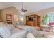 Spacious living room with hardwood floors, natural light, and a cozy seating arrangement at 6360 Brookline Ct, Cumming, GA 30040