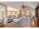 Spacious living room with vaulted ceiling, fireplace, and open floor plan to kitchen at 6360 Brookline Ct, Cumming, GA 30040