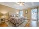 Relaxing main bedroom features a ceiling fan, tray ceiling, natural light, and neutral decor at 6360 Brookline Ct, Cumming, GA 30040