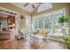Bright sunroom filled with wicker furniture and natural light at 6360 Brookline Ct, Cumming, GA 30040