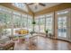 Bright sunroom filled with natural light, featuring tile floors and comfortable seating, perfect for relaxation at 6360 Brookline Ct, Cumming, GA 30040