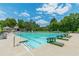 Community swimming pool features multiple lap lanes and diving blocks, perfect for exercise and recreation at 6360 Brookline Ct, Cumming, GA 30040