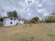 Wide backyard features a lovely deck perfect for entertaining and outdoor enjoyment with lush greenery at 341 Baggett Cir, Lawrenceville, GA 30044