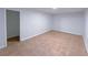 This basement room features tile flooring, and white wall paneling at 341 Baggett Cir, Lawrenceville, GA 30044