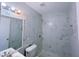 This bathroom boasts elegant marble tiles, a sleek shower, and modern fixtures at 341 Baggett Cir, Lawrenceville, GA 30044