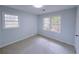 Cozy bedroom with new carpet, large windows providing natural light, and neutral wall color at 341 Baggett Cir, Lawrenceville, GA 30044