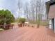 Expansive wooden deck features built-in seating and tranquil backyard views, perfect for entertaining or relaxing at 341 Baggett Cir, Lawrenceville, GA 30044