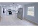 Modern kitchen featuring white cabinetry, stainless steel appliances, granite countertops and tile flooring at 341 Baggett Cir, Lawrenceville, GA 30044