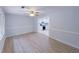 Open-concept living room with luxury vinyl plank flooring and views into the modern updated kitchen at 341 Baggett Cir, Lawrenceville, GA 30044