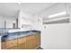 Basement bar with updated countertops and ample cabinet storage at 7025 Kimberly Mill Rd, Atlanta, GA 30349