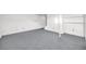 The finished basement features open shelving for storage and a large recreation area at 7025 Kimberly Mill Rd, Atlanta, GA 30349