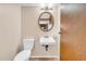 Compact bathroom with wall-mounted sink and tile flooring at 7025 Kimberly Mill Rd, Atlanta, GA 30349