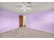 This spacious bedroom features neutral carpeting and a ceiling fan for added comfort at 7025 Kimberly Mill Rd, Atlanta, GA 30349