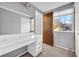 Bedroom featuring built in vanity area and window to the backyard at 7025 Kimberly Mill Rd, Atlanta, GA 30349