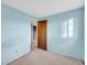 The light blue bedroom with neutral carpeting offers a bright and airy feel at 7025 Kimberly Mill Rd, Atlanta, GA 30349