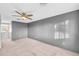 Spacious bedroom with neutral walls and large window at 7025 Kimberly Mill Rd, Atlanta, GA 30349