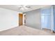 Bedroom featuring ceiling fan and walk-in closet at 7025 Kimberly Mill Rd, Atlanta, GA 30349