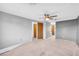 Spacious bedroom features neutral carpeting and a ceiling fan at 7025 Kimberly Mill Rd, Atlanta, GA 30349