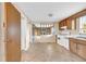 Traditional kitchen with wood cabinets, white appliances, and tile flooring at 7025 Kimberly Mill Rd, Atlanta, GA 30349