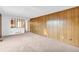 Open living room with paneled walls and easy access to other rooms at 7025 Kimberly Mill Rd, Atlanta, GA 30349