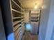 Spacious walk-in closet with built-in shelving at 7025 Kimberly Mill Rd, Atlanta, GA 30349