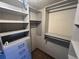 Walk-in closet features shelving and storage drawers at 7025 Kimberly Mill Rd, Atlanta, GA 30349