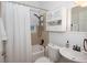 Bright bathroom featuring tiled walls, white fixtures and ample storage at 981 Church St, Decatur, GA 30030