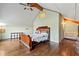 Bedroom with wood floors, paneled ceiling, ceiling fan, and bed with decorative headboard at 2002 Wingate Rd, Atlanta, GA 30341