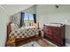 Cozy bedroom with hardwood floors, charming decor, and a large window at 2002 Wingate Rd, Atlanta, GA 30341