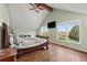 Bedroom featuring hardwood floors, bright windows, and ceiling fan at 2002 Wingate Rd, Atlanta, GA 30341