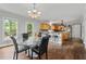 Bright dining area with hardwood floors, chandelier, and bar seating at the kitchen counter at 2002 Wingate Rd, Atlanta, GA 30341