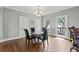 Dining area with hardwood floors, glass-top table and adjacent covered deck at 2002 Wingate Rd, Atlanta, GA 30341