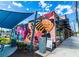 Exterior of a commercial building featuring colorful mural and seating area at 2002 Wingate Rd, Atlanta, GA 30341