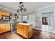 Open kitchen featuring wood cabinets, stainless refrigerator and center island at 2002 Wingate Rd, Atlanta, GA 30341